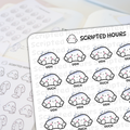 Scripted Hours brand sticker sheets displaying white ghost-like characters with pink cheeks and blue gradient tops, some expressing "UGH" and "OUCH", on a light desk surface with a winking ghost logo and blurred background sticker sheets