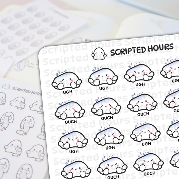 Scripted Hours brand sticker sheets displaying white ghost-like characters with pink cheeks and blue gradient tops, some expressing "UGH" and "OUCH", on a light desk surface with a winking ghost logo and blurred background sticker sheets