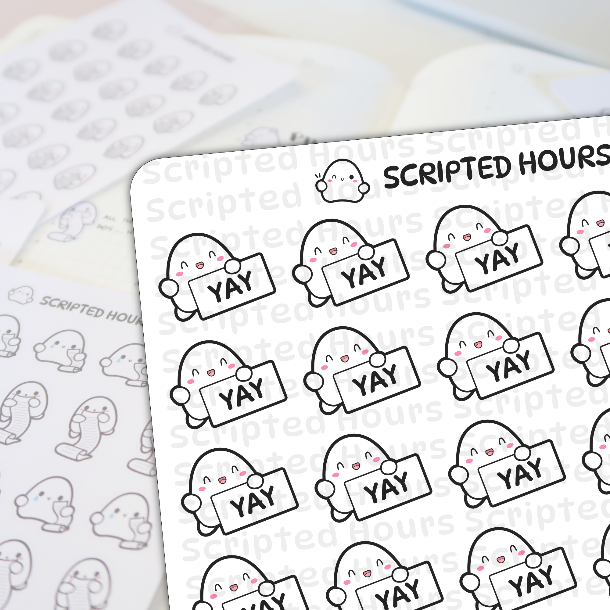 Scripted Hours sticker sheets displaying rows of cheerful white characters with pink cheeks holding 'YAY' signs, alongside a blurred sheet of characters holding scrolls and crying, all beneath the brand's winking logo character