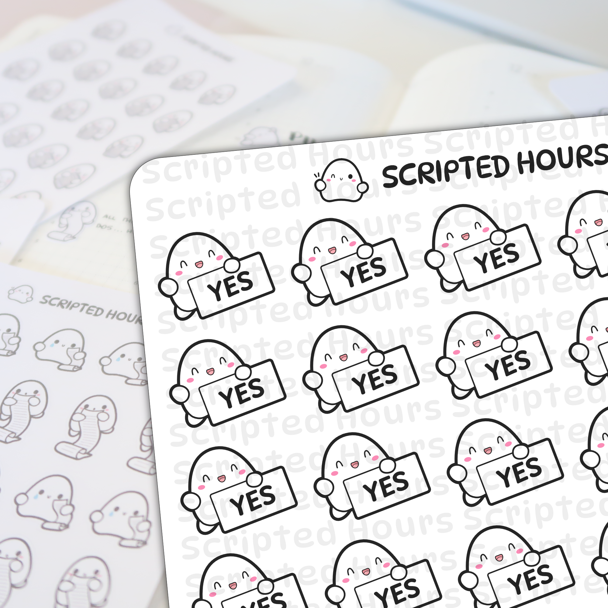 Scripted Hours sticker sheets displaying multiple cute blob-like characters with happy expressions and pink cheeks holding 'YES' signs, with a blurred sheet of characters holding scrolls in the background