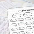 Scripted Hours vinyl sticker sheet with many cute, sleepy white blob characters featuring pink cheeks and small U-shaped eyes, layered over another sticker sheet displaying ghost figures holding scrolls