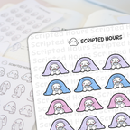 Die-cut vinyl stickers by Scripted Hours featuring adorable white ghost characters snuggled under pastel purple, blue, and pink blankets holding mugs with a blurred background of other monochrome ghost stickers holding long to-do lists