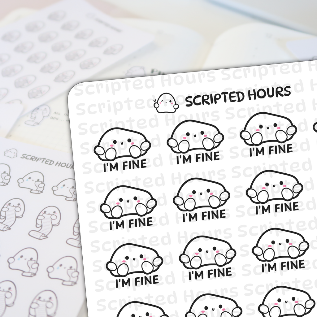 Die-cut vinyl stickers by Scripted Hours depict a sheet of white blob-shaped characters with minimalist black eyes, small 'v' mouths, pink blush cheeks, and "I'M FINE" text below each, with a blurred second sheet of ghost-like scroll-holding characters in the background