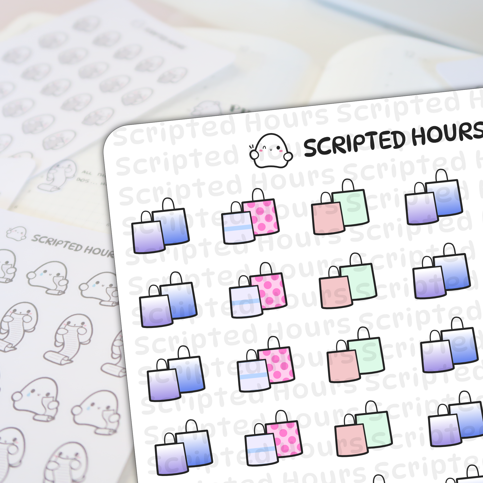 Scripted Hours planner stickers featuring the brand's winking ghost logo and sheets of paired shopping bag stickers in pink polka dot, pastel green, and purple-blue gradients, plus monochrome ghost characters holding shopping lists, all displayed on a clean white desk surface