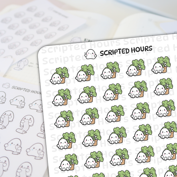 Scripted Hours die-cut sticker sheet displaying rows of cute white ghost characters with pink blush smiles peeking over vibrant green leafy plants in small brown pots, alongside a blurred background sheet of grayscale ghost doodles