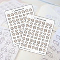 Scripted Hours sticker sheets feature numerous cartoon beige delivery box icons, some single and some stacked, alongside a prominent ghost logo, displayed on a light planner page with faint outline stickers of a ghost character holding a list
