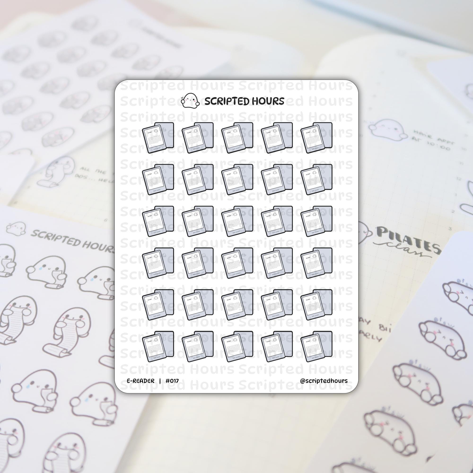 Scripted Hours E-READER #017 sticker sheet with multiple rows of grey e-reader icons featuring the brand logo, layered over a white grid-lined planner with handwritten 'PILATES class' text and a partially visible second sticker sheet of cute ghost characters holding long scrolls