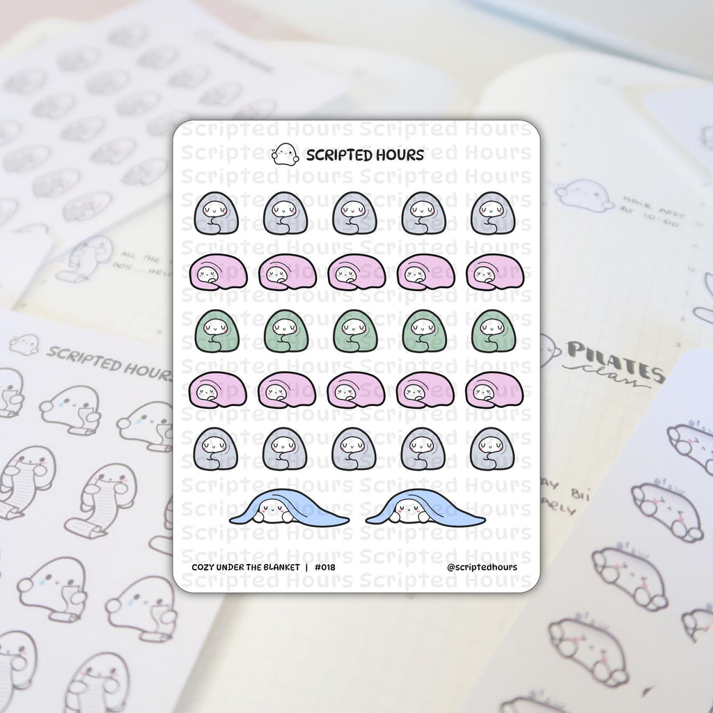 Scripted Hours planner stickers presenting a Cozy Under The Blanket sheet with cute ghost figures wrapped in pink green and grey plus others peeking from blue blankets arranged on an open planner page showing Pilates class and ghost figures holding to-do lists