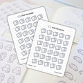 Scripted Hours sticker sheets featuring two planner sticker sets, one with grey e-reader devices and the other with cute white ghost characters holding scrolls, resting on a light-colored planner